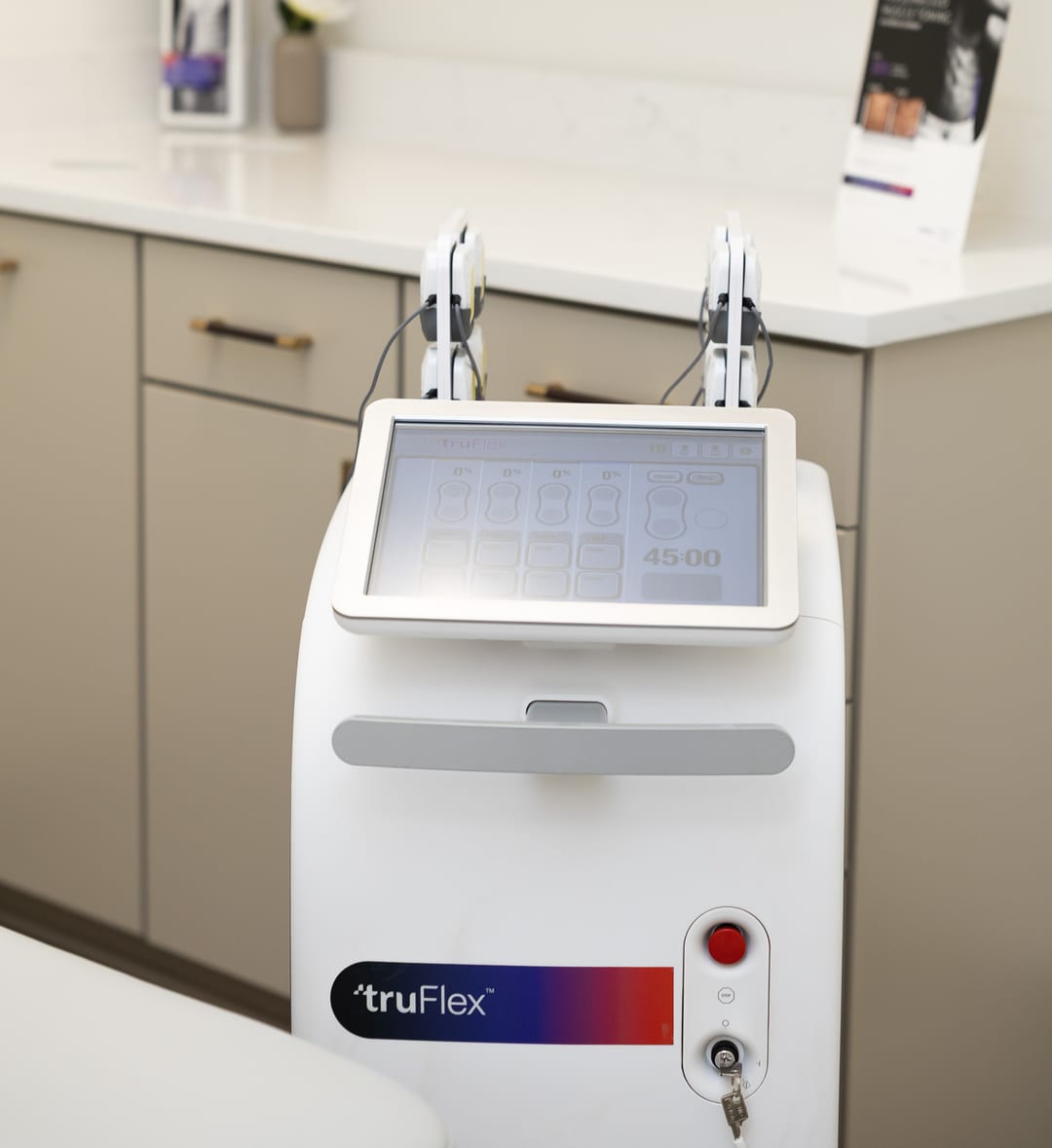 The truFlex muscle toning device in a treatment room at Clinique La Roya
